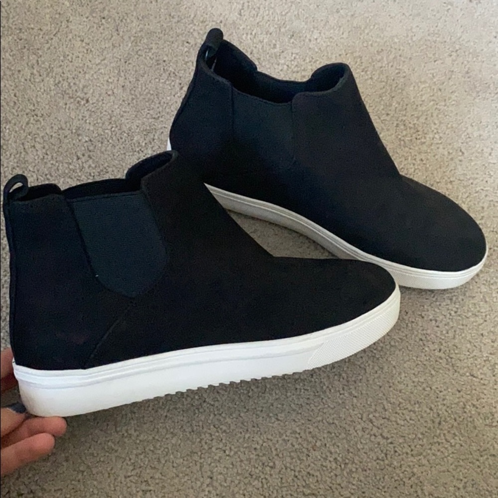 Black suede high top sneakers.